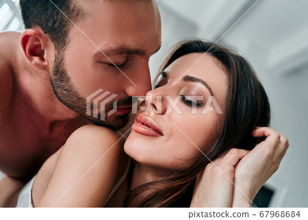 The attractive man and woman kissing 67968684