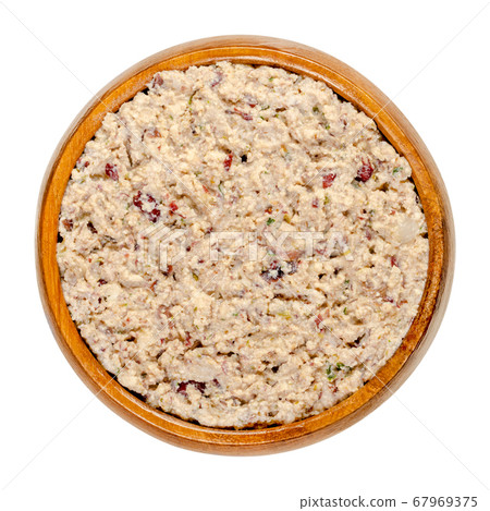 Vegan spread in a wooden bowl. Made of smoked tofu, kidney beans, roasted onions, herbs, salt and pepper. Paste that can be spread with a knife onto bread or crackers. Close-up from above, food photo. Vegan spread in a wooden bowl. Made of smoked tofu, kidney beans, roasted onions, herbs, salt and pepper. Paste that can be spread with a knife onto bread or crackers. Close-up from above, food photo. 67969375