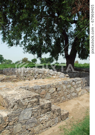 Sirkap, Punjab, Pakistan. Sirkap is an ancient archaeological site and part of the ancient city of Taxila. Taxila is recognized by UNESCO. Ancient buildings of Sirkap at Sirkap, Taxila, Pakistan. 67969405