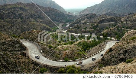 The Khyber Pass in northern Pakistan. Vehicles are climbing the Khyber Pass on the Pakistan side. The Khyber Pass is a vital road link from Peshawar, Pakistan to Landi Kotal and Torkham in Afghanistan The Khyber Pass in northern Pakistan. Vehicles are climbing the Khyber Pass on the Pakistan side. The Khyber Pass is a vital road link from Peshawar, Pakistan to Landi Kotal and Torkham in Afghanistan 67969406