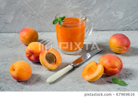 Apricot fruit and apricot smoothie in a glass Apricot fruit and apricot smoothie in a glass 67969616