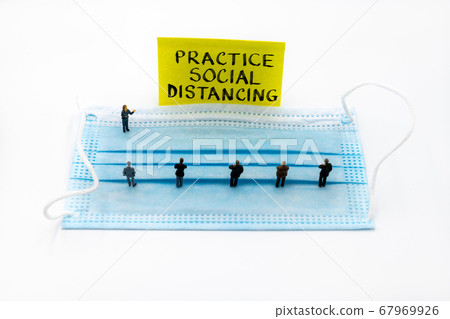 Miniature figurines posed as business people 67969926