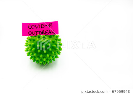 Closeup on green spiky ball as coronavirus 67969948