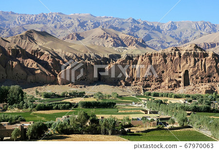 Bamyan (Bamiyan) in Central Afghanistan. This is a view over the Bamyan (Bamiyan) Valley showing the small Buddha niche in the cliff. The Buddhas were destroyed by the Taliban. UNESCO site Afghanistan Bamyan (Bamiyan) in Central Afghanistan. This is a view over the Bamyan (Bamiyan) Valley showing the small Buddha niche in the cliff. The Buddhas were destroyed by the Taliban. UNESCO site Afghanistan 67970063