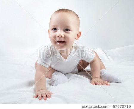 Image of a nine-month-old child on a white background 67970719