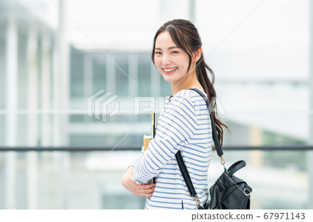 College student walking on campus 67971143