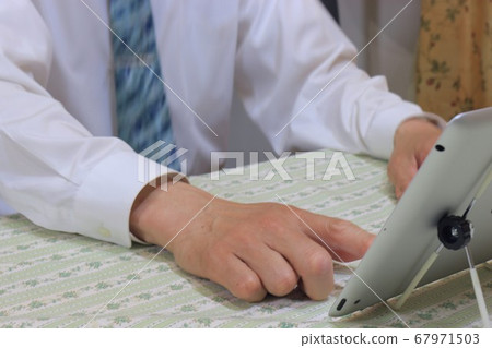 A man who operates a laptop computer A man who operates a laptop computer 67971503