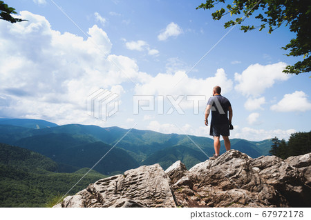 man on a rock 67972178