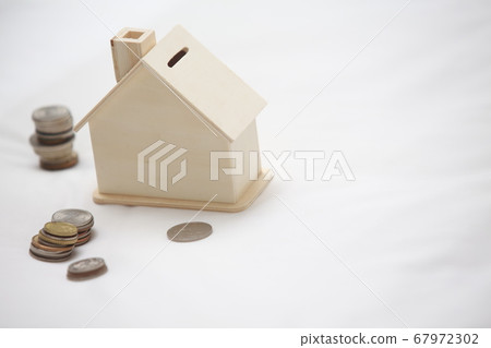 saving the money into the house on the bed saving the money into the house on the bed 67972302