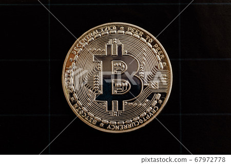 Bitcoin on a black background. 67972778