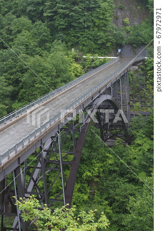 Northern Alps Bridge in the rainy season 67972971