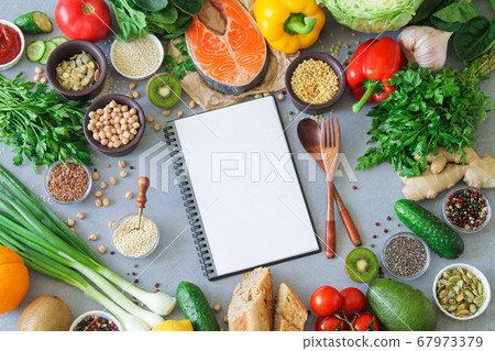Healthy uncooked food frame background with copy space in blank notepad and keto diet and meal plan concept Healthy uncooked food frame background with copy space in blank notepad and keto diet and meal plan concept 67973379