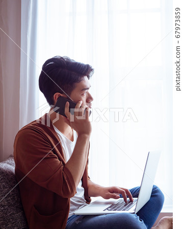 Young man wearing casual clothes and talking on Young man wearing casual clothes and talking on 67973859