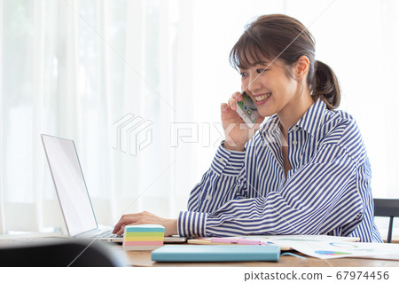 Woman working remotely Woman working remotely 67974456