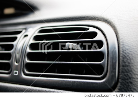 Air conditioner grill in the car closeup 67975473