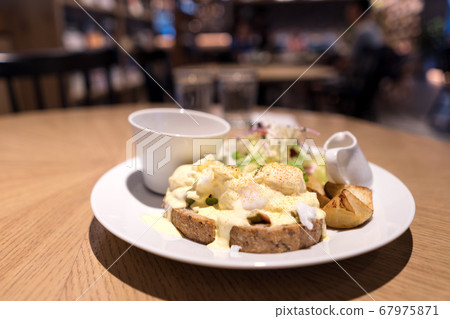 Substantial breakfast with fried egg, salad, bread 67975871