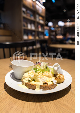 Substantial breakfast with fried egg, salad, bread 67975872