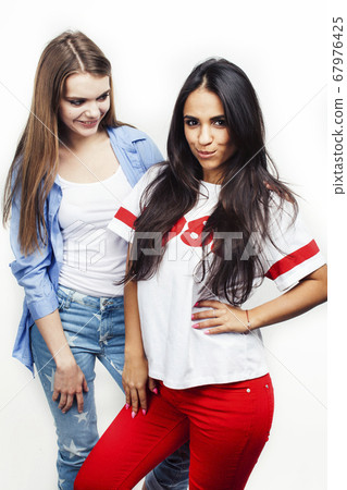 best friends teenage girls together having fun, posing emotional on white background, besties happy smiling, lifestyle people concept, blond and brunette multi nations best friends teenage girls together having fun, posing emotional on white background, besties happy smiling, lifestyle people concept, blond and brunette multi nations 67976425