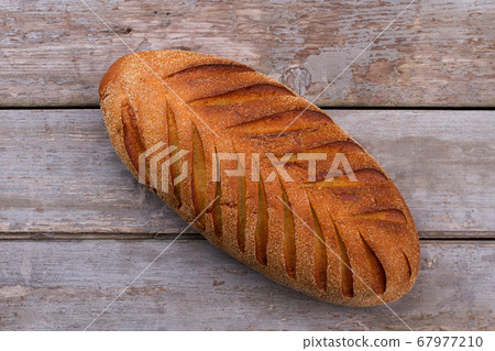 Rustic french bread on wooden background. Rustic french bread on wooden background. 67977210