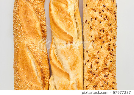 Close up of baguettes with sesame and flax seeds. Close up of baguettes with sesame and flax seeds. 67977287