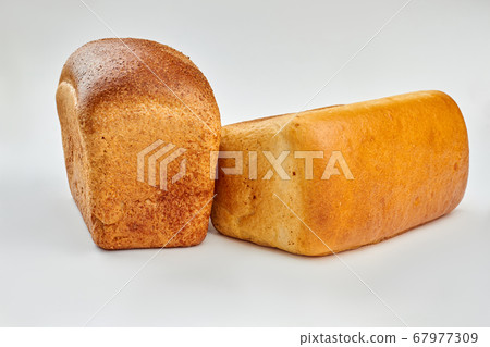 Two loaves of bread on white background. Two loaves of bread on white background. 67977309