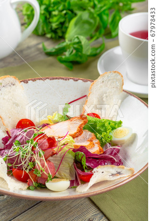 Fresh salad with chicken breast, arugula and tomato. Top view 67978433