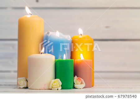 home lighting candles on wooden table. creative photo. 67978540