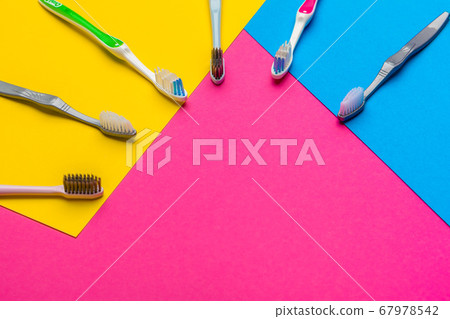Flat lay composition with manual toothbrushes on color background, close up. creative photo. Flat lay composition with manual toothbrushes on color background, close up. creative photo. 67978542