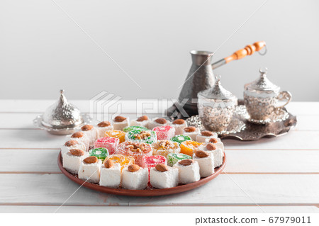 Turkish delight on a wooden table. creative photo. Turkish delight on a wooden table. creative photo. 67979011