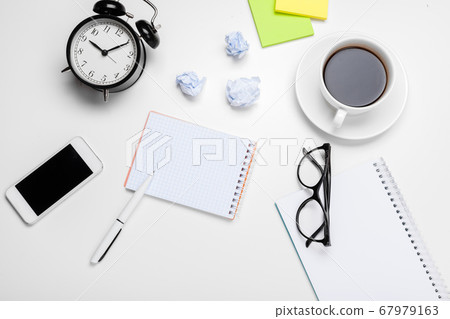 Alarm clock with crumpled paper balls.Timing and thinking idea concept. Alarm clock with crumpled paper balls.Timing and thinking idea concept. 67979163
