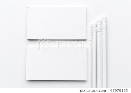 White blank business card. Office table desk with pencil. Top view and copy space for ad text White blank business card. Office table desk with pencil. Top view and copy space for ad text 67979165