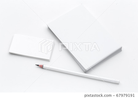 White blank business card. Office table desk with pencil. Top view and copy space for ad text White blank business card. Office table desk with pencil. Top view and copy space for ad text 67979191