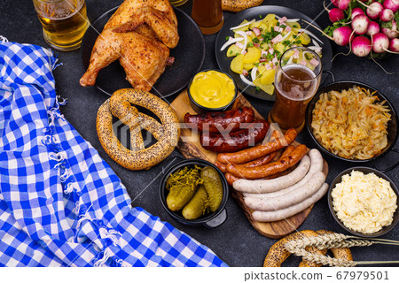 Oktoberfest dishes with beer, pretzel and sausage Oktoberfest dishes with beer, pretzel and sausage 67979501