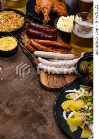 Oktoberfest dishes with beer, pretzel and sausage 67979523