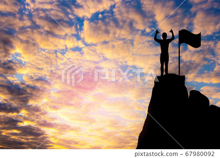Silhouette photo.A man show hand and standing on cliff.A man happy and good feel  for nature.lifestyle,freedom,He is see sun set.Photo concept  achievement and Silhouette. 67980092