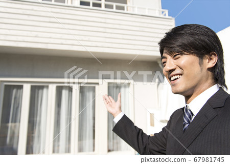 Businessman introducing a property Businessman introducing a property 67981745
