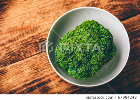Fresh broccoli in white bowl 67984249
