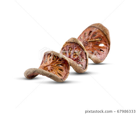dried quince slices an isolated on a white background.clipping path 67986333