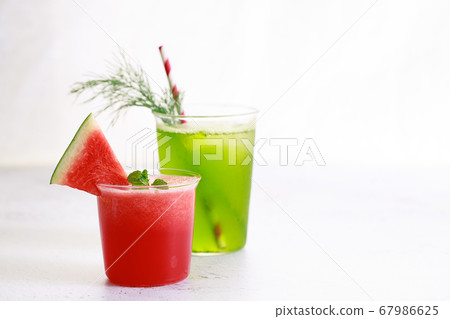 Red watermelon smoothie and green cocktail drink Red watermelon smoothie and green cocktail drink 67986625