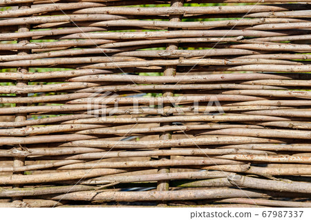 Background of rustic village wicker fence 67987337