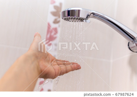 washing concept. Hygiene Man is checking a water 67987624