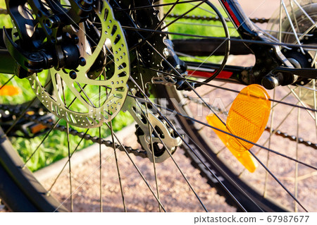 Bicycle wheel: disc brakes, spokes. Cycling, Bicycle wheel: disc brakes, spokes. Cycling, 67987677
