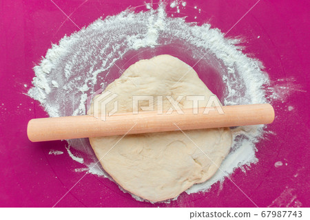 raw dough with flour, and food preparation. raw dough with flour, and food preparation. 67987743