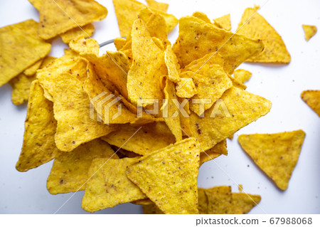 bowl of tortilla chips on white surface, top view. bowl of tortilla chips on white surface, top view. 67988068