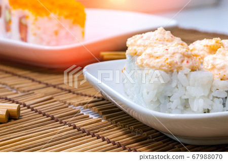 Japanese food restaurant. Sushi with chopsticks, Japanese food restaurant. Sushi with chopsticks, 67988070