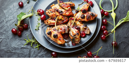 Chicken wings with cherries. Chicken wings with cherries. 67989817