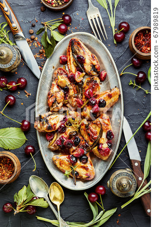 Chicken wings with cherries. Chicken wings with cherries. 67989819
