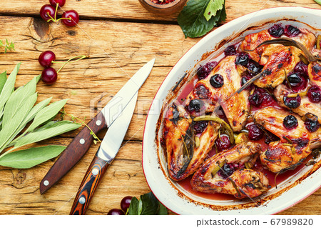 Roasted chicken with cherry. 67989820