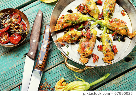Fried zucchini flowers with filling. 67990025