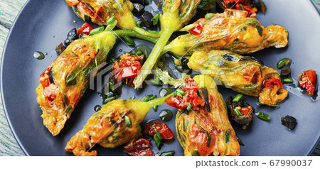 Fried zucchini flowers with filling. 67990037
